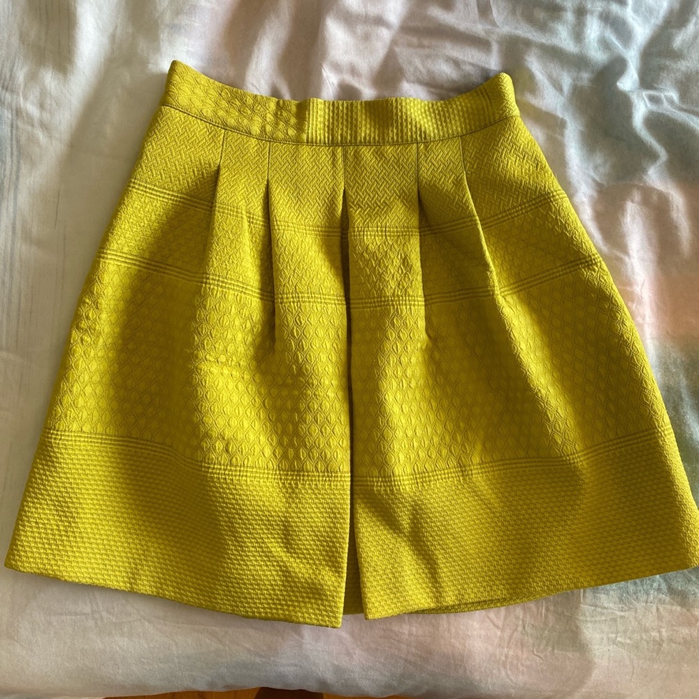 Yellow skater style skirt.